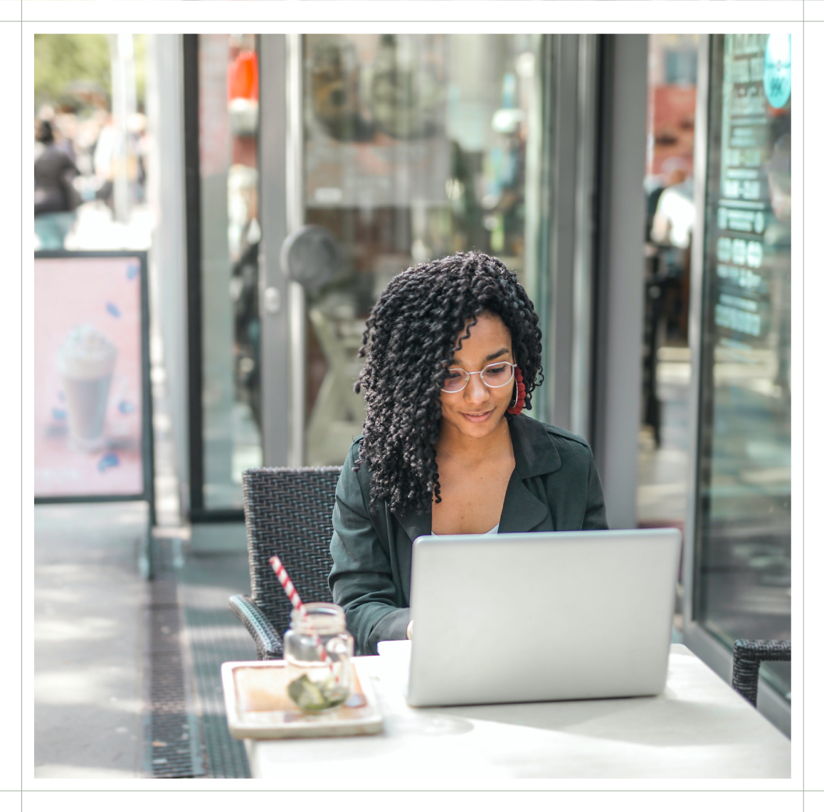 lady-sitting-outside-working-on-her-laptop